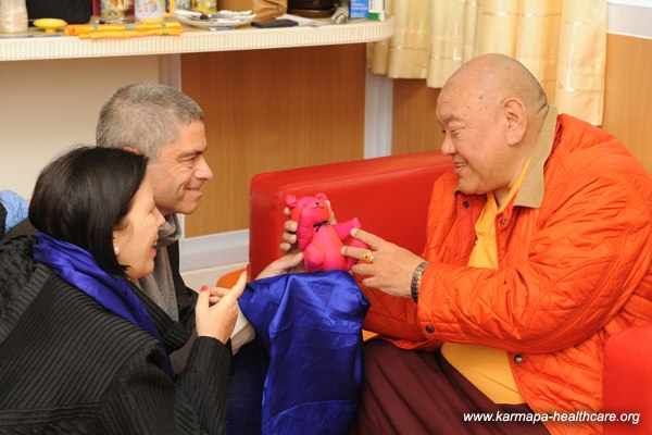 Beru Khyentse Rinpoche receives a Tashi bear for the recent incorporation of the KHCP into his monastery in Bodhgaya