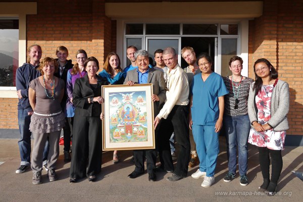 Dr. Ram Sheestra, his colleagues and the KHCP team (KHCP gift: a Medicine Buddha thangka)