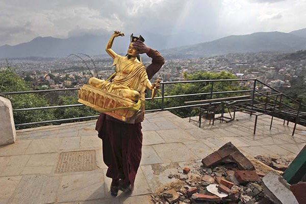Monk saving a Karmapa statue in Kathmandu